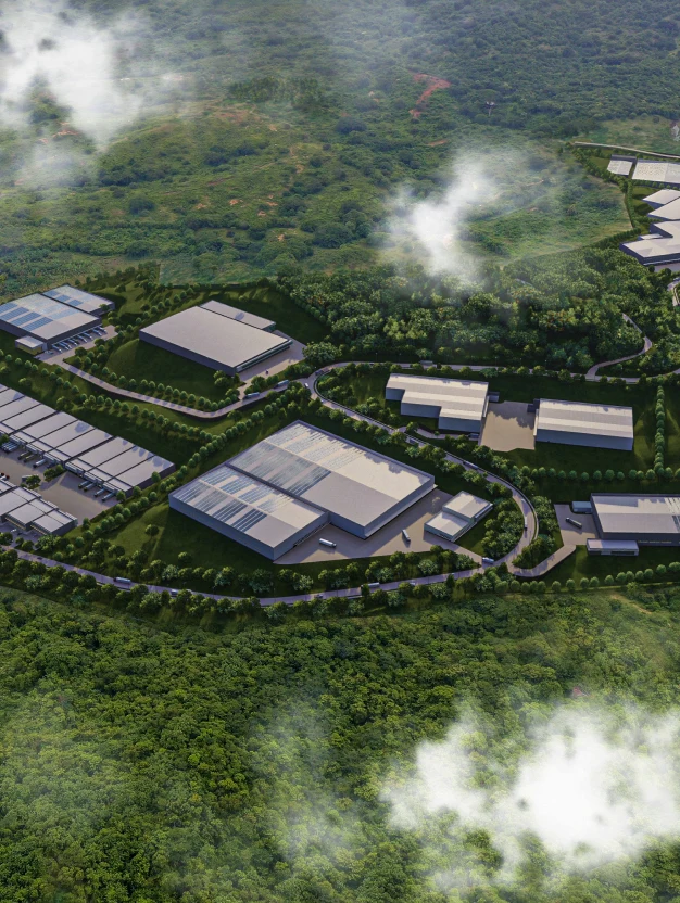 Vista aérea de un parque industrial moderno y sostenible, desarrollado por Dinpro, con amplias zonas verdes y edificios de infraestructura productiva.